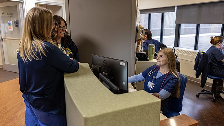 From left, UTMC staff nurse Abby Seeds, lead nurse Jessica Cantrell and staff nurse Lily Simone on the floor of the nationally-recognized UT